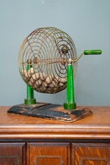 Vintage Metal Bingo Cage Green Bakelite Tower Pillars handle w/ wooden balls