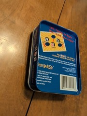 LCR® Left Center Right™ Dice Game – Blue Tin