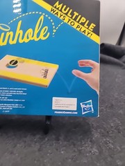 Coinhole Game The Tabletop Coin Bouncing Party Game by Hasbro Gaming