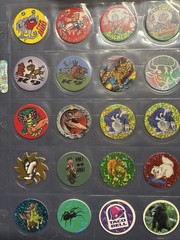 Collection Of Pogs And Slammers 335 Pogs And Slammers – 21 Plastic 9 Metal Slamm