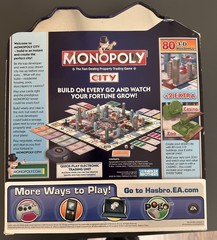 MONOPOLY CITY Metal TIN Box Edition Game 2009 New in Box. Never Played
