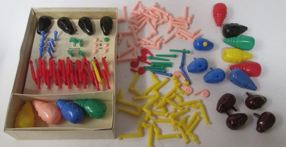 The Game of “Cootie” partial set w/ lots of additional pieces & box dated 1949