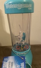 TOMY Water Games — Dolphin Ring Toss and Pelican Ball Basket Catch Toys – NEW