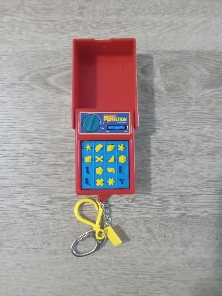Perfection The Game Keychain 2000 FUN Milton Bradley Mini A Few Pieces Missing