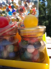 Vintage RATTLE BATTLE and small Jars with tops plastic DISPLAY with MARBLES!