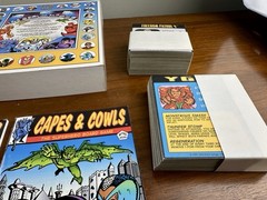 Capes & Cowls: The Superhero Board Game Adventures in Wyrd City Ultra Super Rare